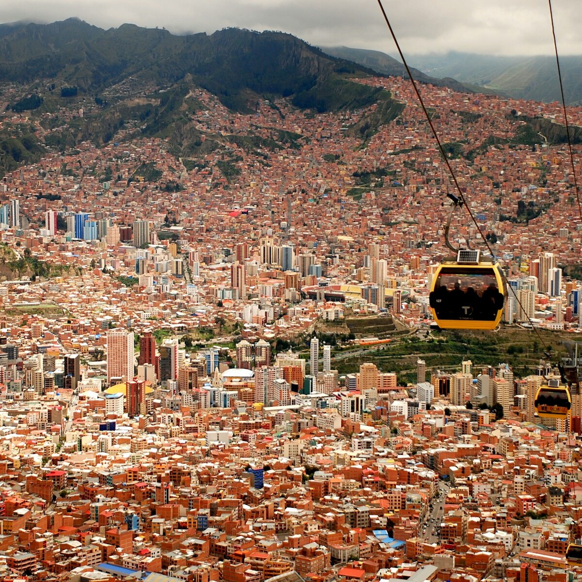 four running cable cars during daytime