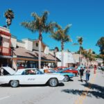 white coupe parked on street during daytime