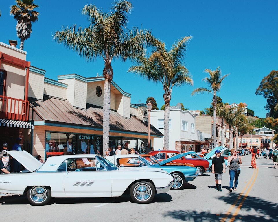 white coupe parked on street during daytime
