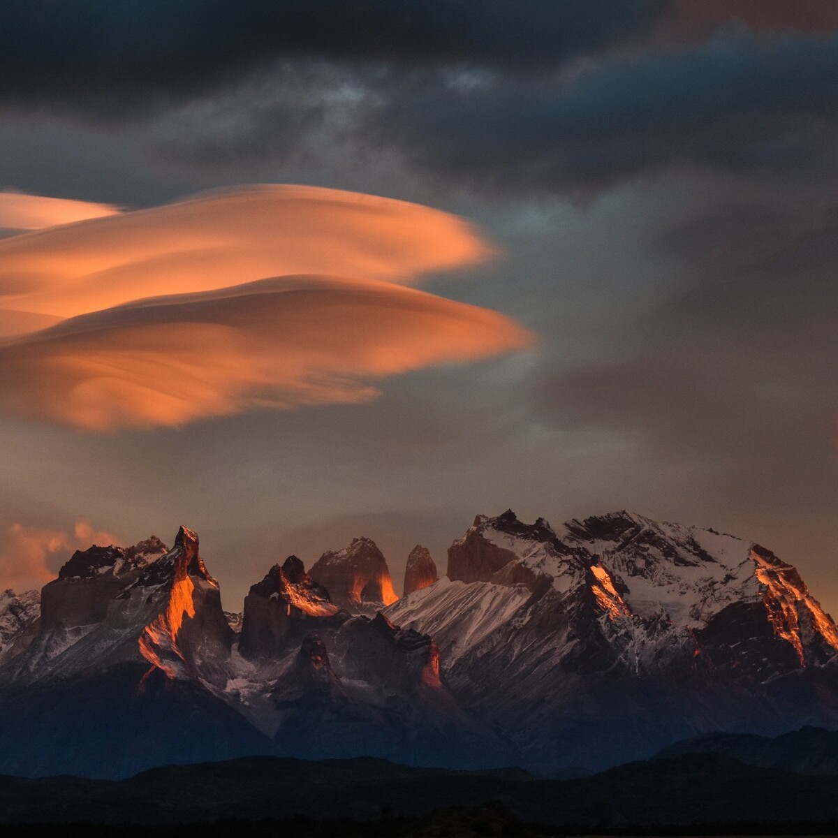 rocky mountain under orange sky
