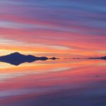 a sunset over a beach