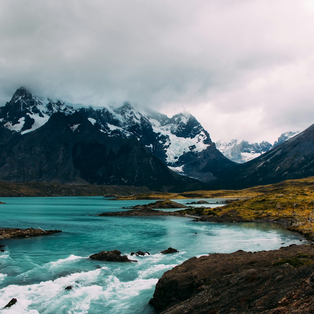 body of water surrounded by mountains