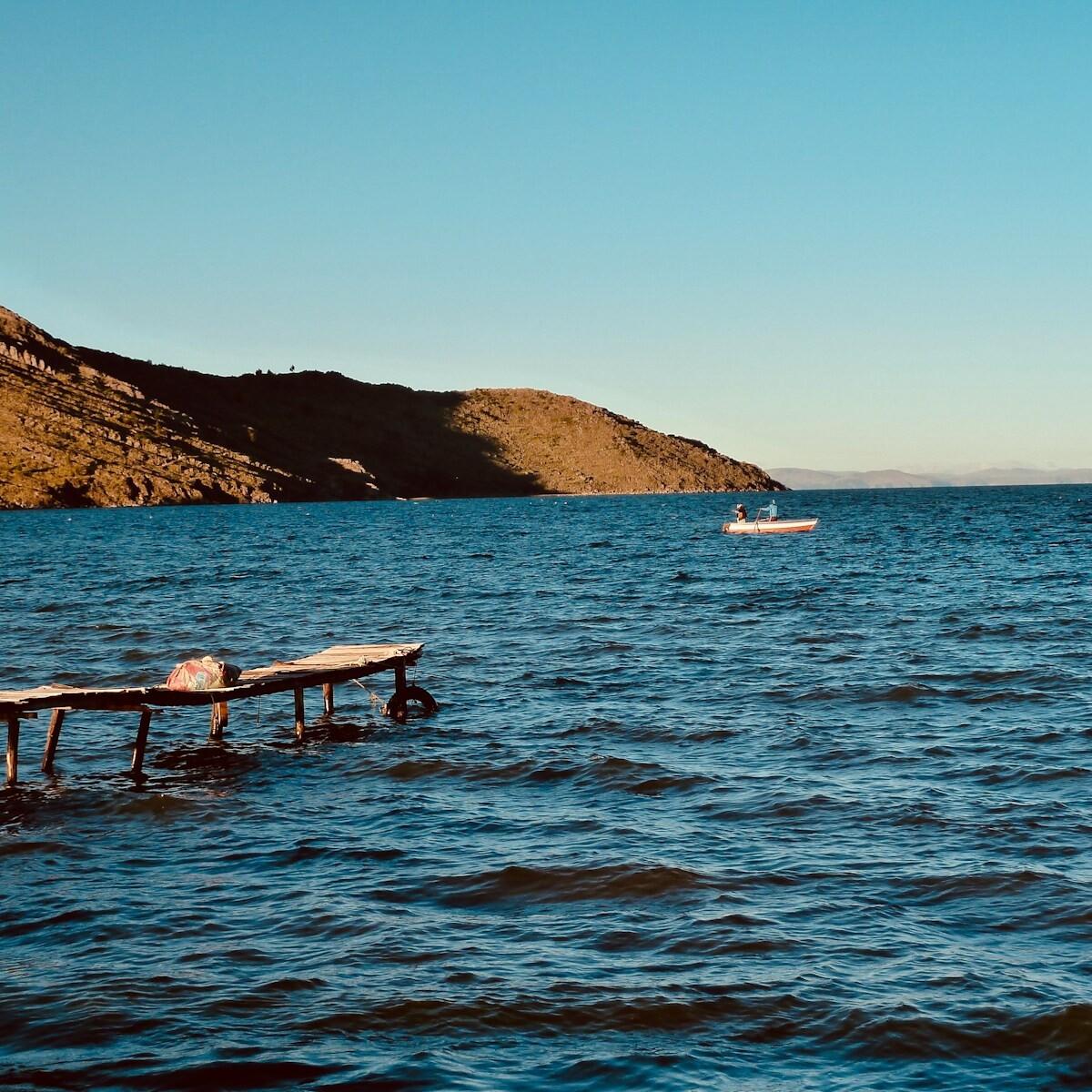 white and brown boat on sea during daytime